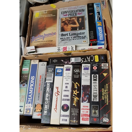 47 - A large quantity of D.V.D.s along with V.H.S tapes and players and other items in one box.