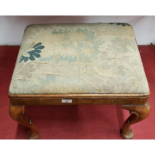 85 - A 19th Century Walnut Stool with Queen Anne shaped legs and tapestry upholstery.