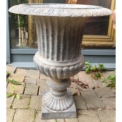 246 - A pair of Cast Iron Urns with reeded and fluted outline. H 68 x Diam 54.