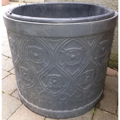 257 - A Circular Gothic style Black Planter. H43 x 50cm.