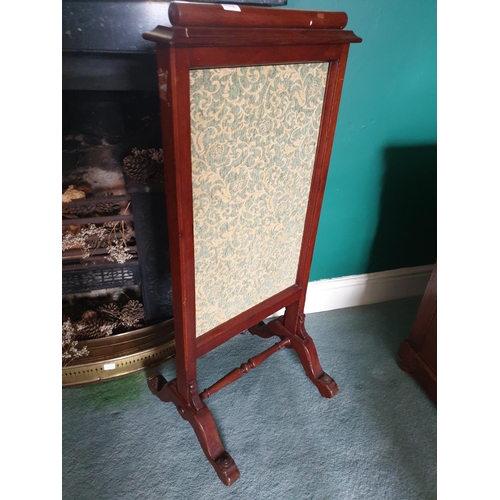 6417 - A 19th Century Mahogany Fire Screen with a fabric panel centre.