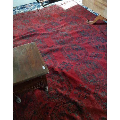 94 - A large Burgundy Ground Rug with all over decoration. 320 x 226cm and one other.