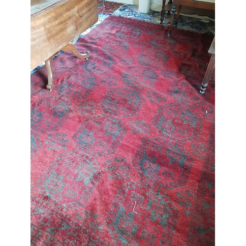 94 - A large Burgundy Ground Rug with all over decoration. 320 x 226cm and one other.