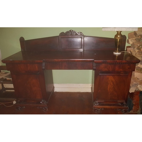 339 - An Irish William 1Vth Mahogany Pedestal Sideboard with a carved and moulded base and doors and with ... 