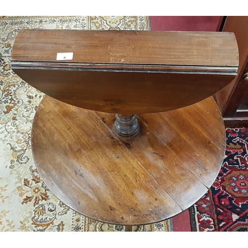 350 - A Georgian Mahogany drop leaf two tier Dumbwaiter.