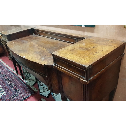 355 - An early 19th Century Regency Mahogany Sideboard with reeded outline on square fluted supports. Circ... 