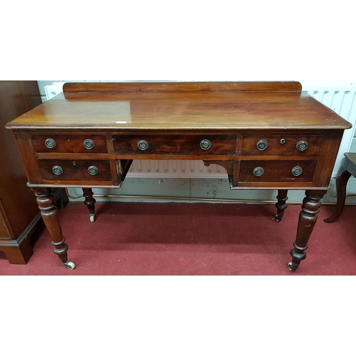 379 - A good 19th Century Mahogany Kneehole Desk with twin drawers flanking a single drawer centre on turn... 