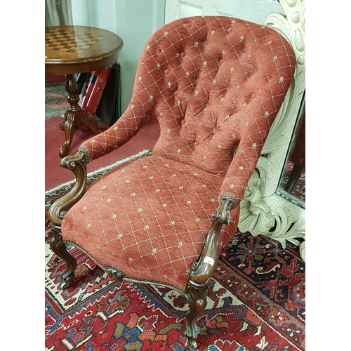 382 - A 19th Century Rosewood Showframe deep buttoned Armchair with carved cabriole front supports.