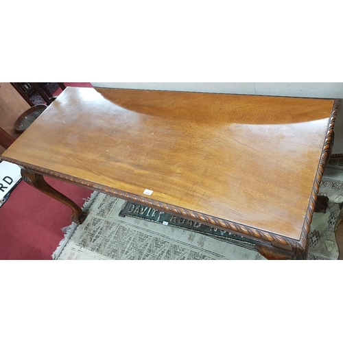 447 - A good modern Mahogany Centre Table with ball and claw supports. Approx H72 x W152 x D62 cms.