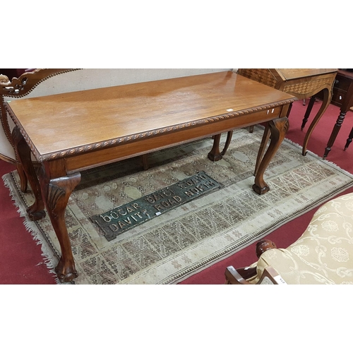 447 - A good modern Mahogany Centre Table with ball and claw supports. Approx H72 x W152 x D62 cms.