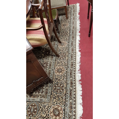 661 - A lovely large Cream Ground Carpet with allover decoration and multi borders.364 X 280 cms.