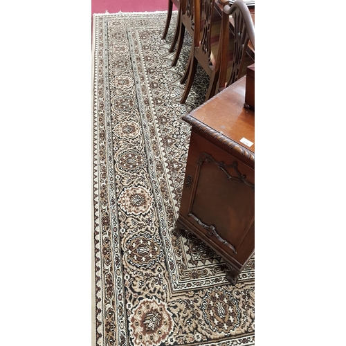 661 - A lovely large Cream Ground Carpet with allover decoration and multi borders.364 X 280 cms.