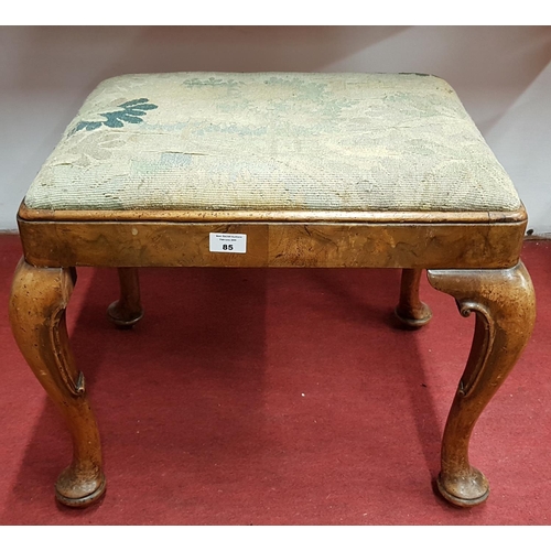 598 - A 19th Century Walnut Stool with Queen Anne shaped legs and tapestry upholstery.