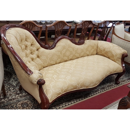 599 - A Victorian style deep buttoned Mahogany Showframe Chaise Longue.