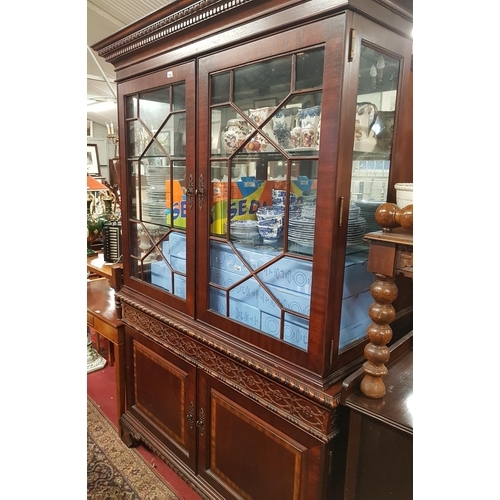 605 - A large two door glazed Display Cabinet with a roped edge.H 212 W 134 D 44.