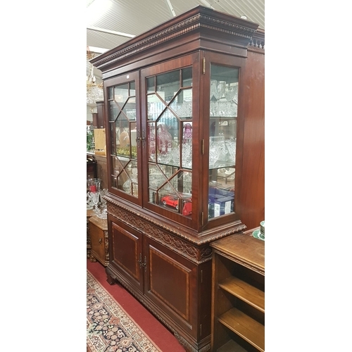 605 - A large two door glazed Display Cabinet with a roped edge.H 212 W 134 D 44.