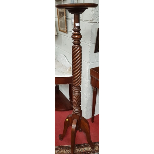 614 - A 19th Century Mahogany Torchere Stand.