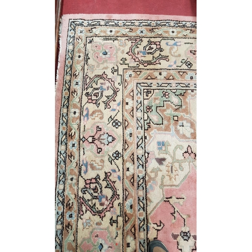 688 - A very large Pink Ground Carpet with allover decoration.435 X 335 cms.