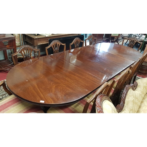 690 - An early 20th Century Mahogany three pillar D end Dining Table with a fluted frieze. Approx L282 x W... 