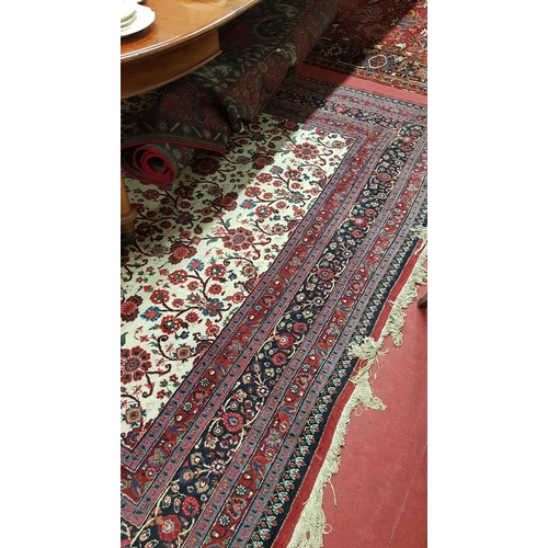 660 - A good Burgundy Ground Rug with multi borders and allover decoration.