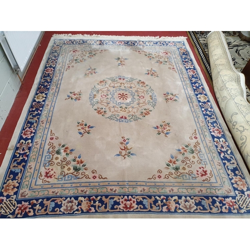 513 - A really good oriental Carpet with cream ground. 330 x 248 cms.