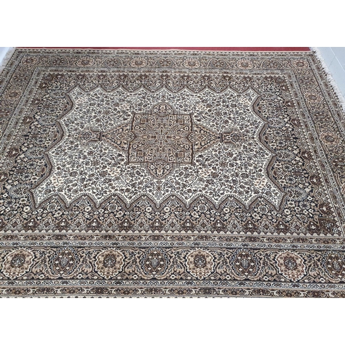 661 - A lovely large Cream Ground Carpet with allover decoration and multi borders.364 X 280 cms.