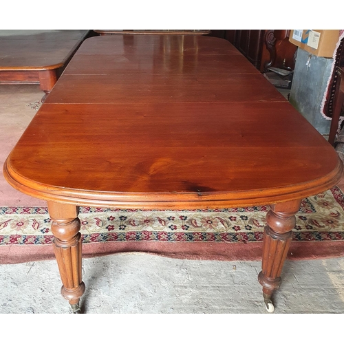 112 - A good 19th Century mahogany Dining Table with two extra leaves and with a highly carved turned supp... 