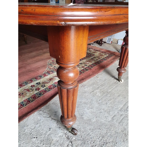 112 - A good 19th Century mahogany Dining Table with two extra leaves and with a highly carved turned supp... 