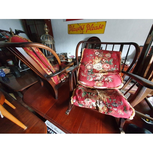 117 - An Ercol style Three Piece Suite consisting of a three seater couch an armchair and a rocking chair.