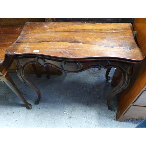 186 - A 19th Century Rosewood fold over Card Table on cabriole supports.