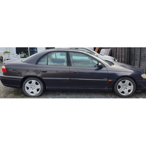 2 - A 2000 Vauxhall Omega 3.1 V6. Automatic with cream leather seats. No paperwork.