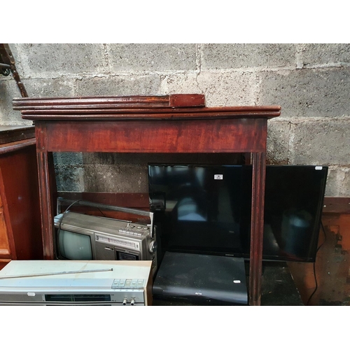 233 - An early 19th Century Mahogany Empire two door Cabinet with ormolu mounts and a black marble top. (d... 