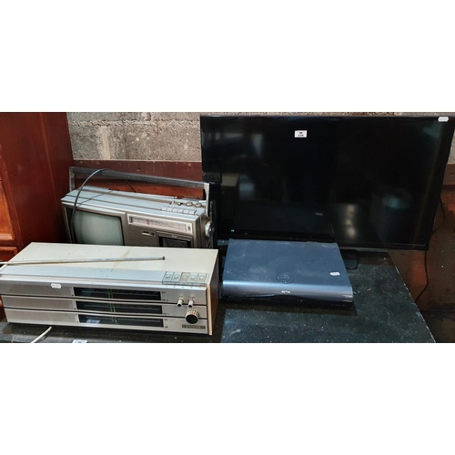 234 - A Samsung Television, a vintage Sharp TV/Tape deck, vintage radio and sky box.