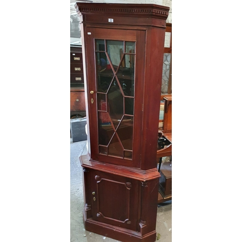 243 - A Mahogany Corner Cabinet with shell detail.