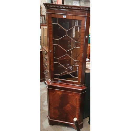 259 - A Mahogany Veneered Corner Cabinet.