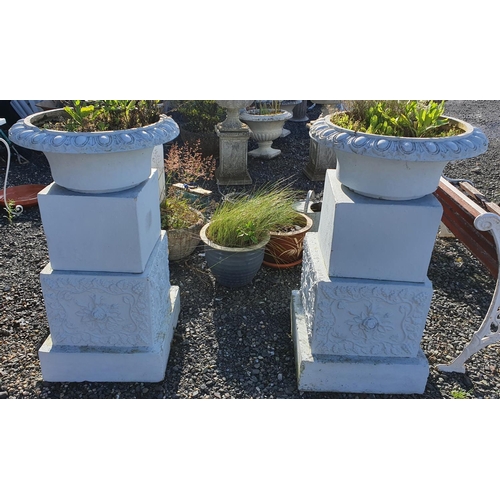 28 - A large pair of reconstituted Stone Urns of unusual feature.