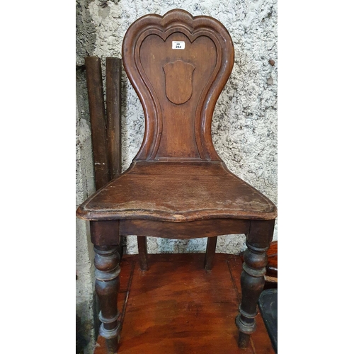 284 - A Victorian Oak Hall Chair.