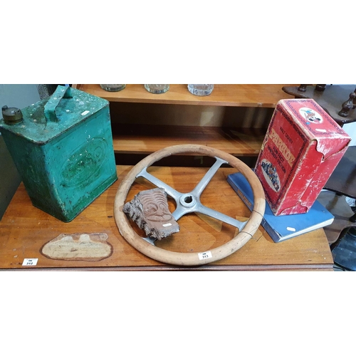 313 - A Vintage Timber and Aluminium Steering Wheel, an Esso oil can along with other items.