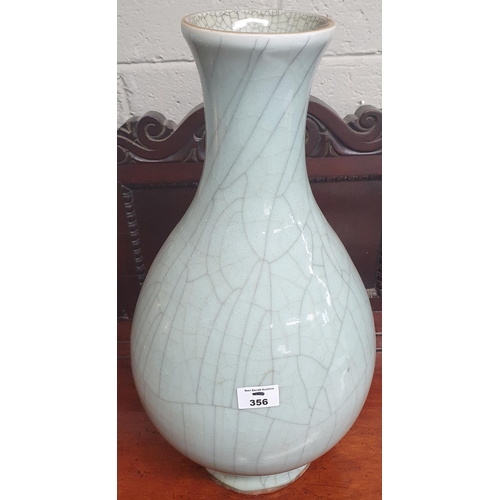 356 - Property of The 5 star Hotel. A large Duck Egg Blue/turquoise vase with aged effect.