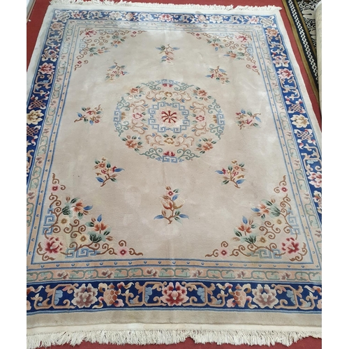 513 - A really good oriental Carpet with cream ground. 330 x 248 cms.