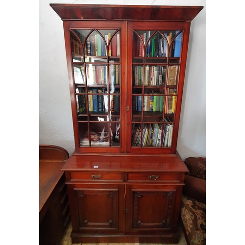 74 - A late 19th Century Mahogany two door Bookcase with glazed upper section and sunken panel door base.... 