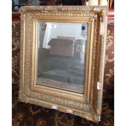 77 - A good Victorian Plaster Gilt Mirror with bevelled glass. In need of restoration.