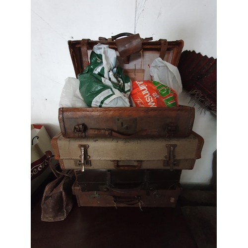 93 - A quantity of 19th Century and later leather Suitcases along with a metal food bin.