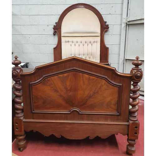 948 - A 19th Century Mahogany Bed with an arch top deep buttoned headboard and solid footboard.