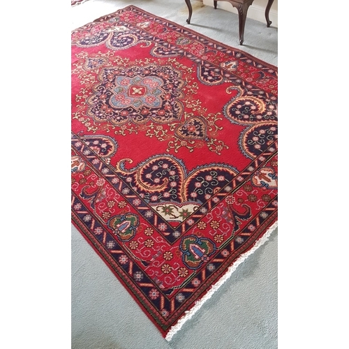 618 - A Persian Red Ground Tabriz Carpet.Size 285 x 198cms.