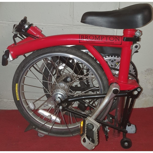 453 - A Brompton Foldup Bike. As new with three gears.