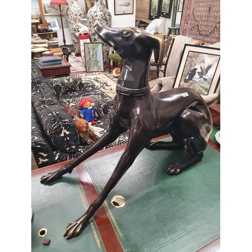 627 - The property of The 5 star Hotel in London. A large Bronze Casting of a Greyhound. 95 cms L x 40 w x... 