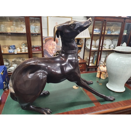 627 - The property of The 5 star Hotel in London. A large Bronze Casting of a Greyhound. 95 cms L x 40 w x... 