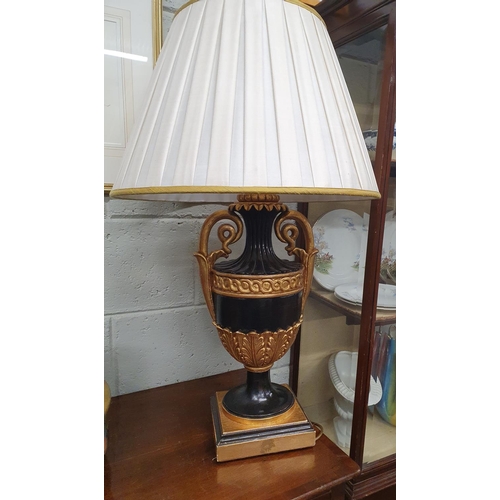 630a - The property of The 5 star Hotel in London. A very large ebonised and gold Table Lamp.