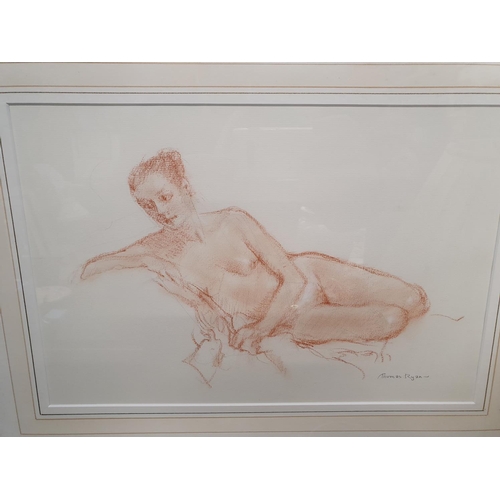 631 - A Crayon Drawing of a naked Woman by Thomas Ryan. Signed LR. 36 x 24 cms.